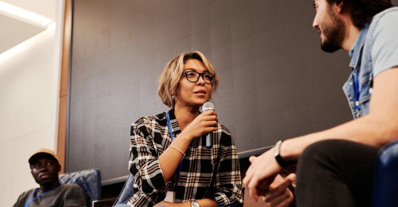 Networking Conference - Woman talking to a Man using Mic