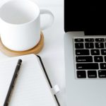 Alumni Network - Workplace with laptop and opened diary