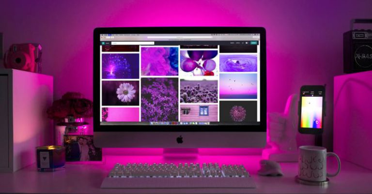 Organized Desk - Silver Imac Displaying Collage Photos