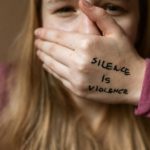 Social Anxiety - Woman in Purple Shirt Covering Her Face With Her Hand