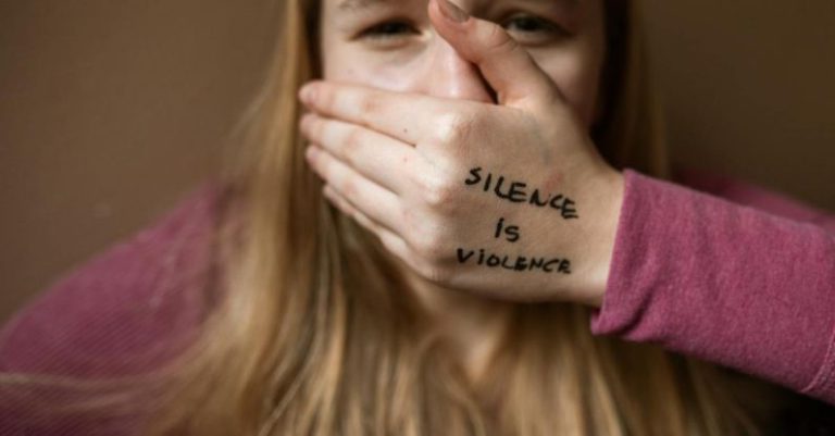 Social Anxiety - Woman in Purple Shirt Covering Her Face With Her Hand