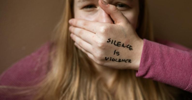 Social Anxiety - Woman in Purple Shirt Covering Her Face With Her Hand