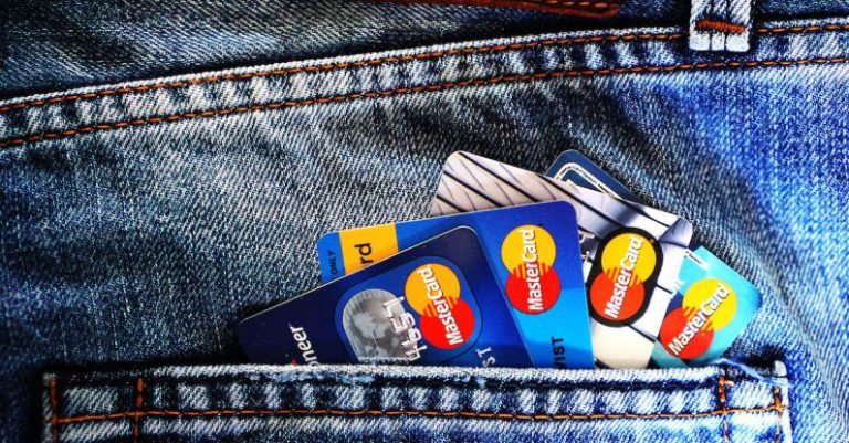 Credit Score - Blue Master Card on Denim Pocket