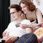 Spending Habits - Man and Woman Shopping Online