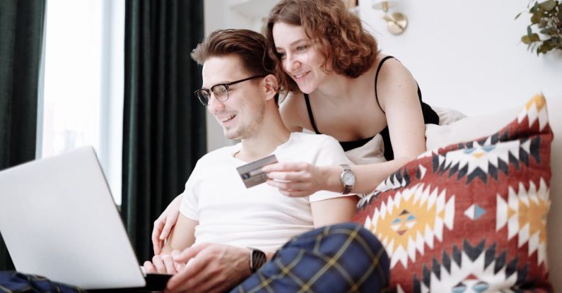 Spending Habits - Man and Woman Shopping Online