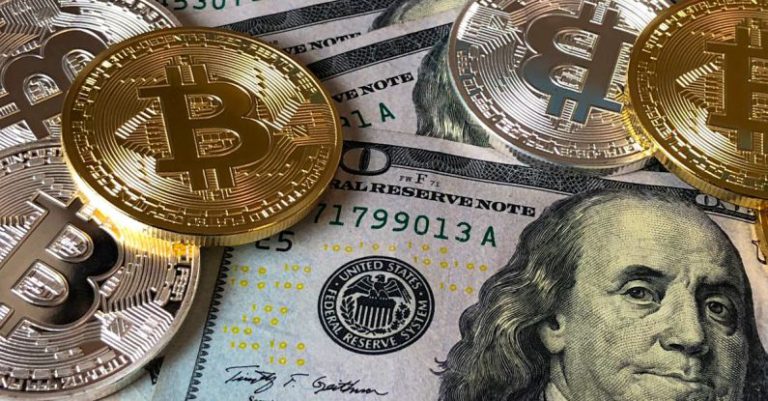 Cryptocurrency Coins - Bitcoins and U.s Dollar Bills