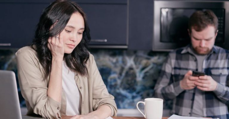 Family Finances - Stressed Woman Looking at Documents