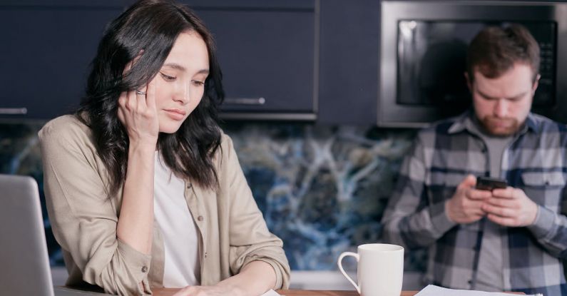 Family Finances - Stressed Woman Looking at Documents