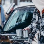 Digital Detox - Couple with Thermos and Metal Mugs in Forest in Winter