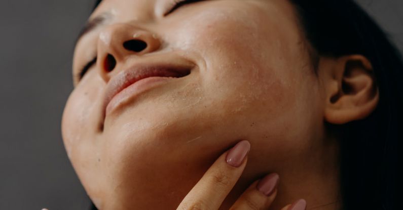 Self-care Routine - A Woman Touching Her Neck with Her Eyes Closed