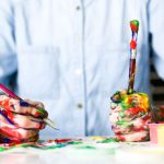 Creativity - person holding click pen