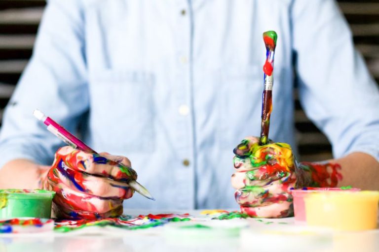 Creativity - person holding click pen