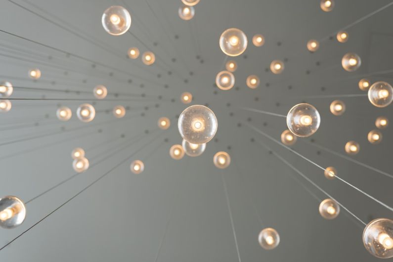 Inovation - low angle photography of drop lights