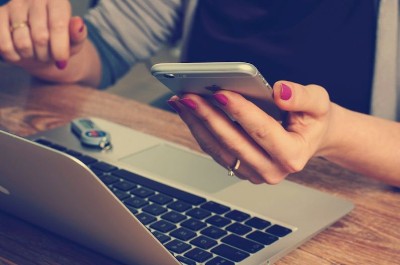 Networking Work - woman holding silver iPhone 6