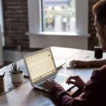 Networking Work - man operating laptop on top of table