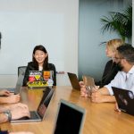 Leadership - people in a meeting discussing app development