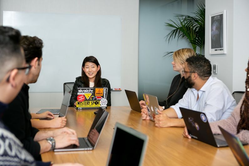 Leadership - people in a meeting discussing app development