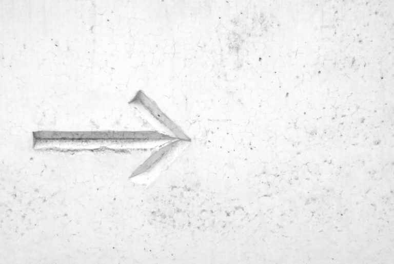 Leadership - right arrow sign on wall