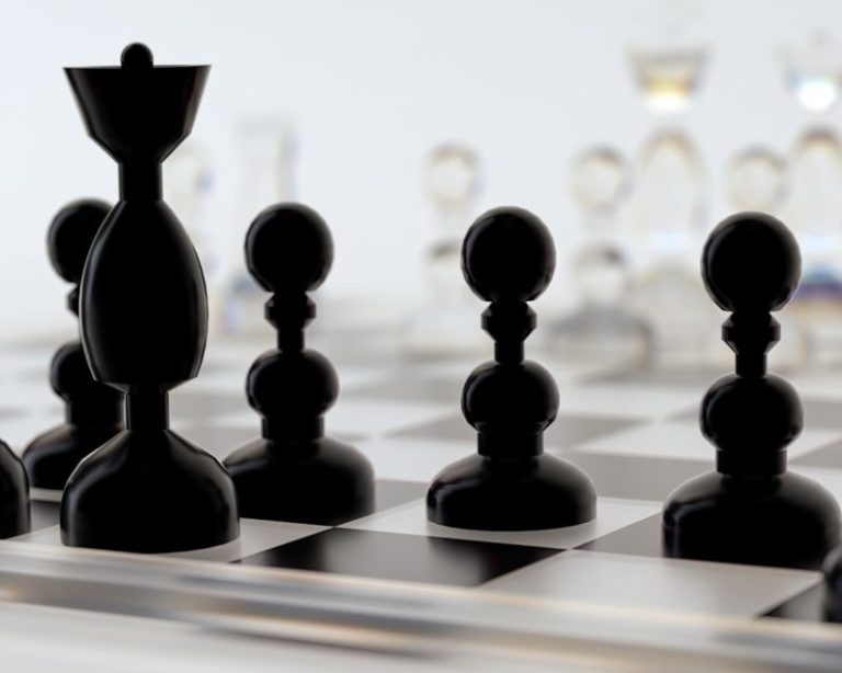 Leadership - a close up of a chess board with pieces on it