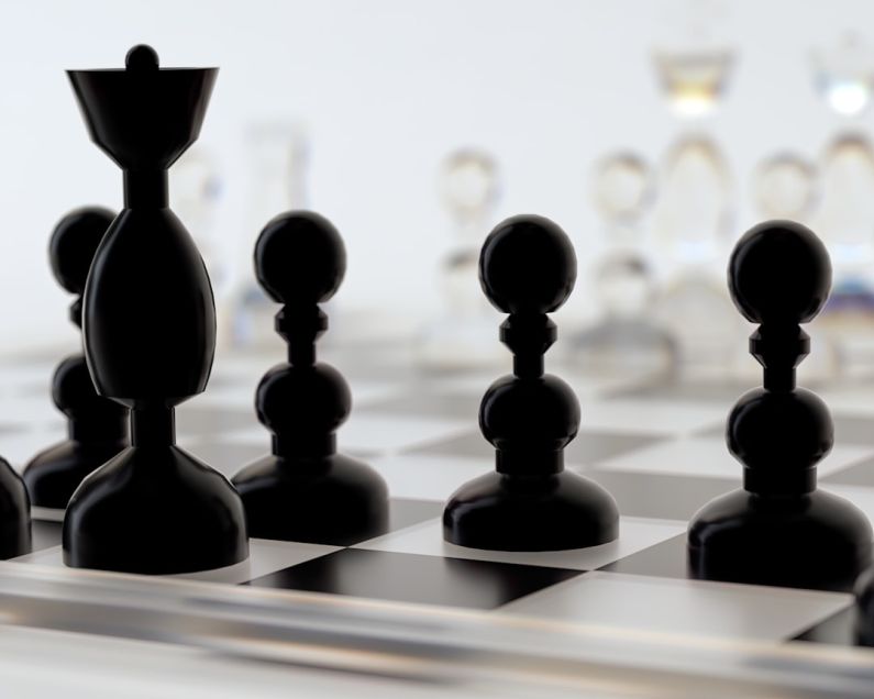 Leadership - a close up of a chess board with pieces on it