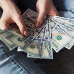 Financial Stability - fan of 100 U.S. dollar banknotes
