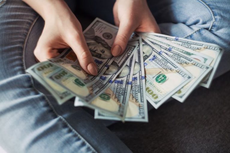 Financial Stability - fan of 100 U.S. dollar banknotes