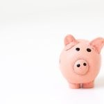 Financial Stability - pink pig figurine on white surface