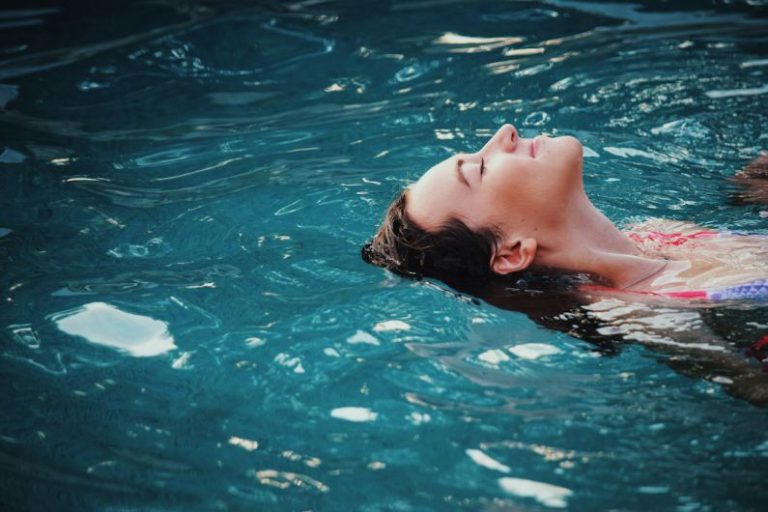 Relax - woman floating on body of water