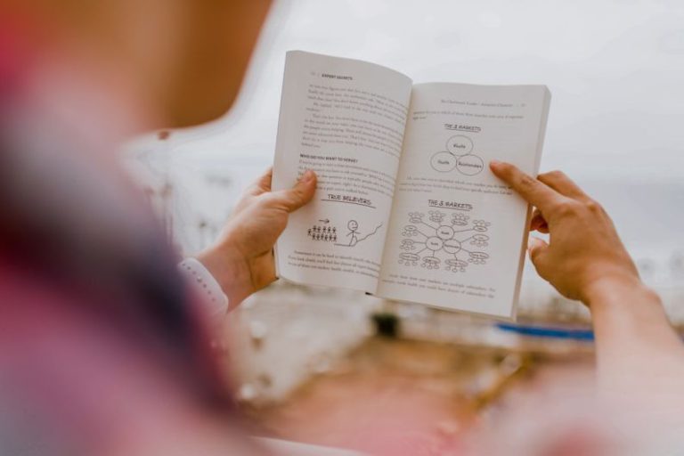 Personal Development - person reading book during daytime