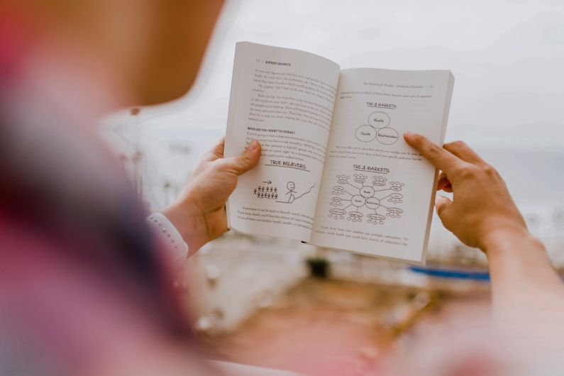 Personal Development - person reading book during daytime