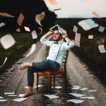 Learning - man sitting on chair with book