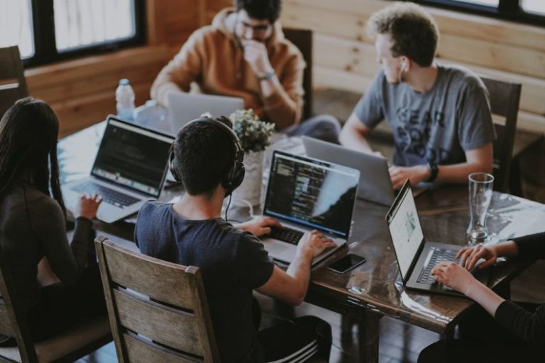 Learning Business - group of people using laptop computer