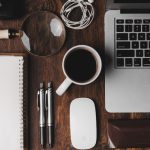 Productivity - cup of coffee near MacBook Pro